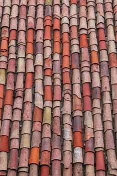 Vertical roof tiles of an old house in a village
