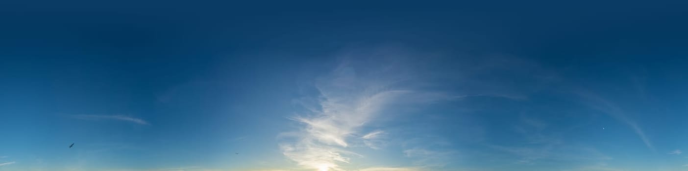 Bright sunset sky panorama with Cirrus clouds. Seamless hdr spherical equirectangular 360 panorama. Sky dome or zenith for 3D visualization, game and sky replacement for aerial drone 360 panoramas.