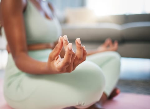 Yoga, meditation and zen hands of black woman in living room fitness, exercise and mindfulness, healing and peace. Meditate, spiritual and calm person in lotus pose at her home for self care wellness.