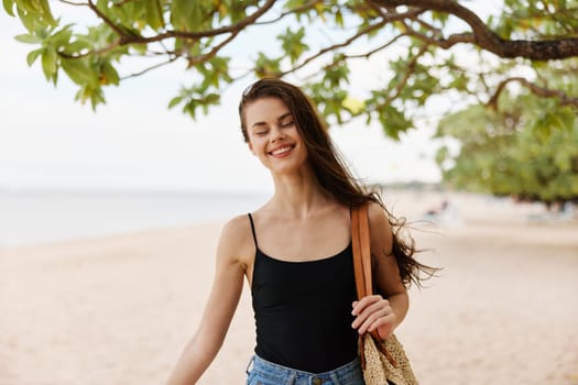 woman dress nature vacation young water copy-space copy peaceful beautiful relax smile shore space walk happy beach sand ocean sea summer freedom