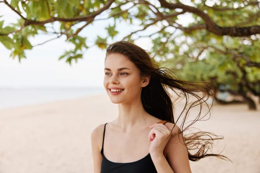 woman beach young caucasian vacation sand running person sea outdoor hair long copy-space copy ocean smile enjoyment summer lifestyle space sunlight nature relax