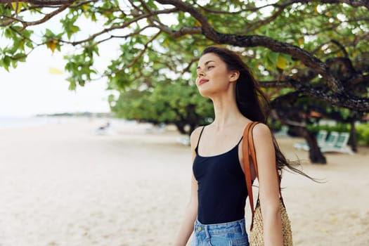 woman sun copy-space vacation summer beautiful smile sea nature running dress hair tropical holiday smiling ocean freedom young sand long beach enjoyment