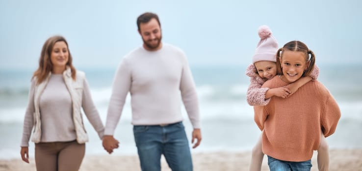 Family, beach and love, travel and adventure with parents holding hands and kids piggy back, walking by the ocean. Together out in nature, sea and mother, father and children have fun bonding