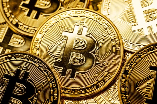 Background of gold coins with bitcoin sign