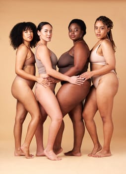 Diversity women, portrait and body positivity friends hug for inclusion, beauty and power. Underwear model group beige background for cellulite legs, pride and motivation for self love or skin care.