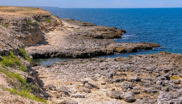 Karst cavity failure in the rocky shore, flooded by water in the eastern Crimea, Black Sea