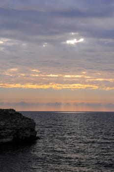 Beautiful Sunset in the clouds over the Black Sea in eastern Crimea