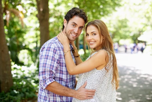 Couple hug, bonding and portrait on love date, valentines day or romance in nature park or relax garden. Smile, happy or embrace for woman and man in girlfriend trust, security and honeymoon support.