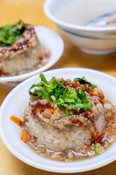 Rice pudding (Tube rice cake), popular delicious taiwanese street food gourmet delicacy, made by glutinous rice and pork with sweet chili sauce.