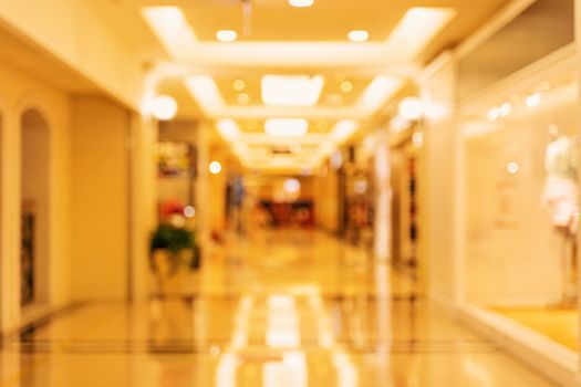 Luxury department store shopping mall interior, abstract defocused blur with bokeh background, concept of shopping seasons design.