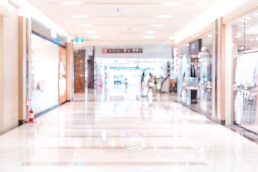 Luxury department store shopping mall interior, abstract defocused blur with bokeh background, concept of shopping seasons design.