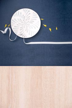 Conceptual Mid-Autumn Festival table background, symbol of moon, clouds and stars in the sky with plate, ribbon and yellow petal. Top view, flat lay.