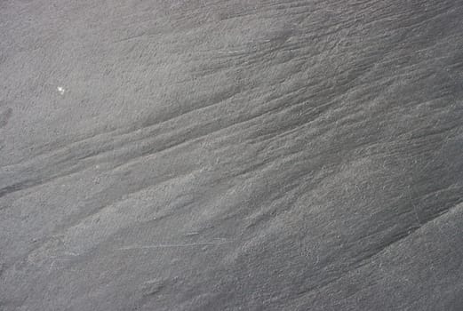 The texture of the stone in gray close-up.