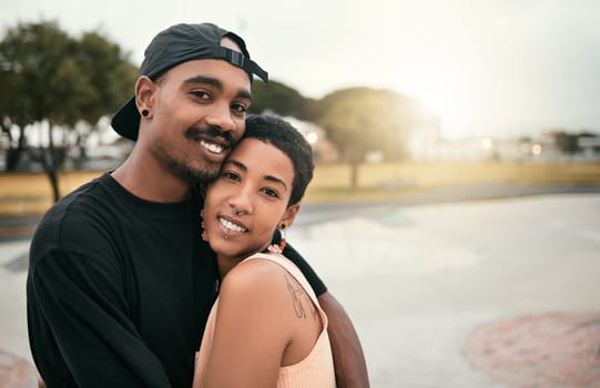 Skate, love and portrait of black couple hug in city enjoying weekend, free time and summer. Skating, trendy fashion and young black man and woman in relationship, dating and embrace in skate park.