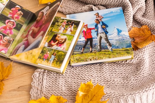 photobook album and yellow leaves.