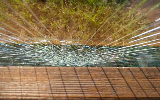 Broken glass at a street bus stop . High quality photo