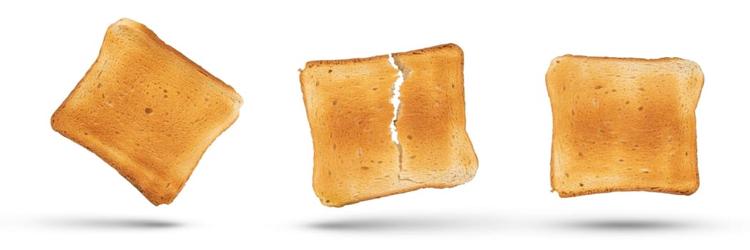 A set of golden slices of bread from a medium rare toaster on a white isolated background. Slices of bread for diet breakfast or sandwiches