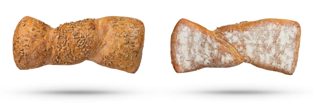 Homemade white bread isolate with seeds and whole grains. Top and bottom view of a loaf of fresh bread on a white isolated background. The concept of baking bread