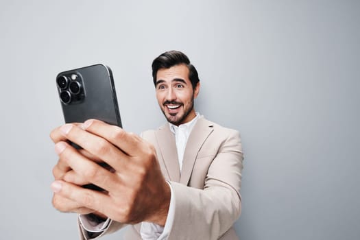 business man call young beard phone background phone hold lifestyle businessman smile cell adult portrait happy smartphone mobile studio male message suit