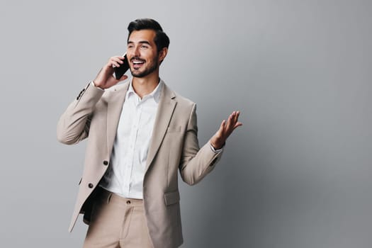 man lifestyle online cellphone entrepreneur trading studio happy message phone call business hold portrait background cyberspace smile suit guy application smartphone