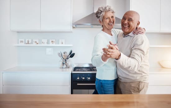 Love, dance and portrait of old couple in kitchen at home, weekend time and celebrate romance with smile. Retirement, happiness and health, happy man and senior woman dancing in house or apartment