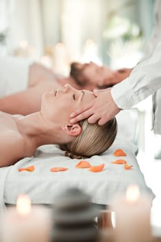 Spa, couple head massage and healthcare or skincare of a woman feeling relax and peace. Wellness, beauty and luxury facial body therapy and cosmetic dermatology or bodycare at a salon.