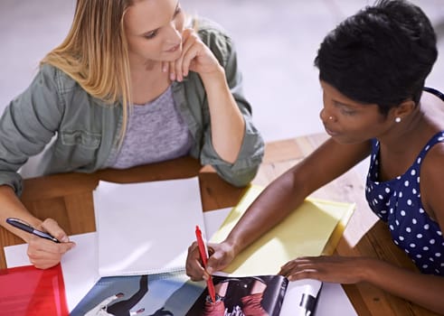 Women in strategy meeting at fashion magazine agency, conference room and collaboration. Diversity, top view and creative team of female employees working together, editorial ideas and brainstorming.