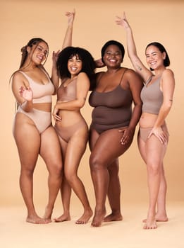 Diversity women, celebration and body portrait of friends group together for inclusion, beauty and power. Underwear model people on beige background with cellulite, pride and motivation for self love.