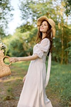 a cheerful woman with a basket in her hands walks through the woods enjoying a day off. High quality photo