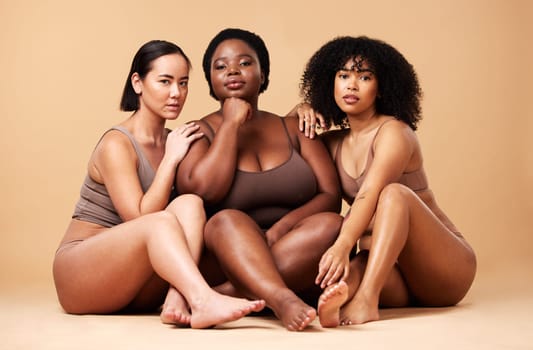 Body, skin and portrait of diversity women friends together for inclusion, beauty and power. Aesthetic model group on beige background for skincare glow, pride and motivation for underwear self love.