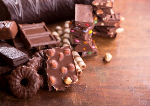 gingerbread cookies and chocolate on a wooden background