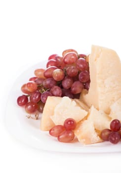 Parmesan cheese and grapes isolated on a white backgroun. View from above