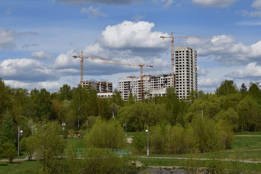 Moscow, Russia - 4 May.2023. Liebherr cranes build residential buildings