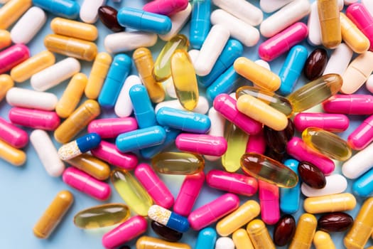 Lots of colorful pills and capsules for different symptoms. Concept of health and medicine