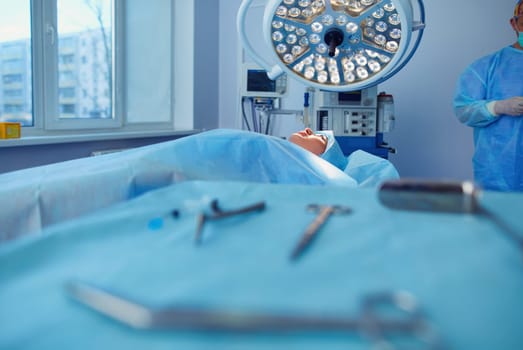 Man surgeon at work in operating room.