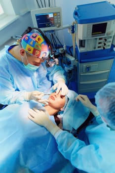Team surgeon at work in operating room.
