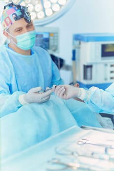 Male surgeon on background in operation room.