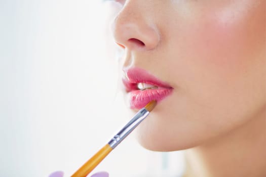 Beautiful girl with cosmetic powder brush for make up. Makeup. Make-up applying for perfect skin.