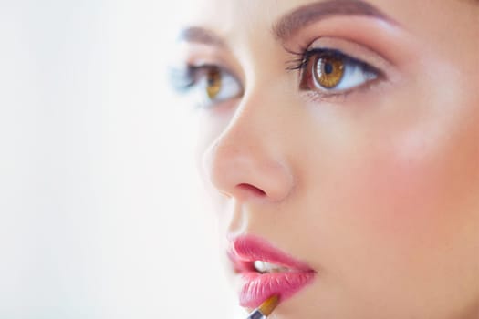 Beautiful girl with cosmetic powder brush for make up. Makeup. Make-up applying for perfect skin.