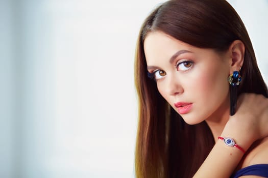 Beautiful young woman with professional make up.