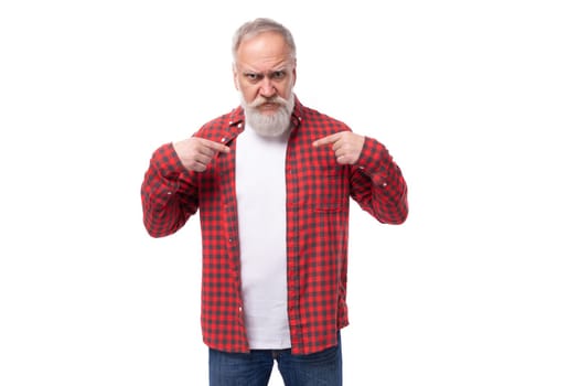 handsome 60s middle aged mature man in stylish look pointing fingers.