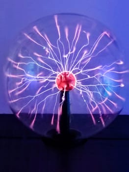 Tesla plasma ball with light beams inside, lightning effect