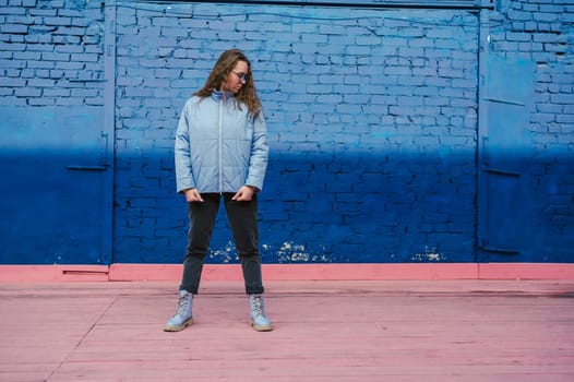 Portrait of a stylish woman in blue jacket. Spring outdoor portrait.