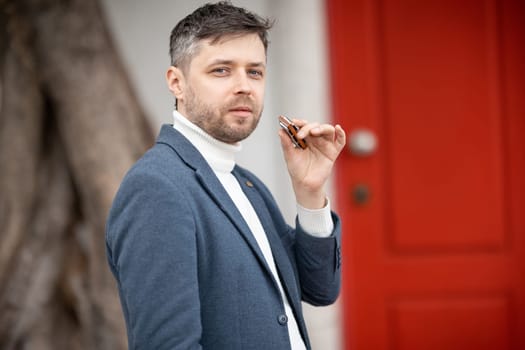 Adult man with harmonica - looking at the camera. Portrait
