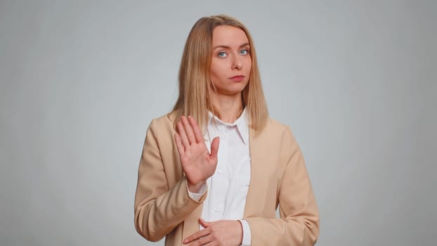 I am not guilty, not my fault. Portrait of young businesswoman pointing fingers herself ask say who me no thanks i do not need it. Female girl in formal suit. Woman isolated on gray studio background