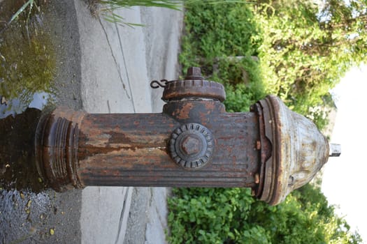 Rusty Old Fire Hydrant Leaking Water in New York City. High quality photo