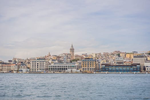 Istanbul city skyline in Turkey, Beyoglu district old houses with Galata tower on top, view from the Golden Horn.