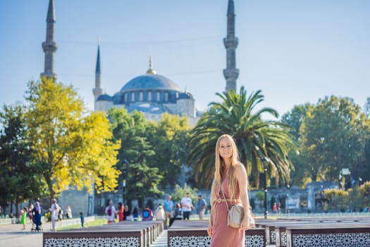 Woman tourist enjoying the view Blue Mosque Sultanahmet Camii Istanbul, Turkey.