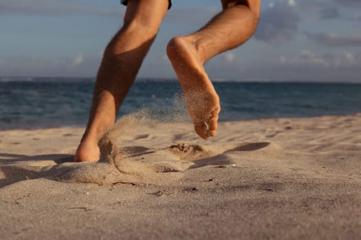 close-up. feet in the sand. run. bali