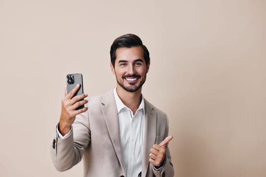 man connection gray smile portrait message young holding phone hold businessman lifestyle cellphone happy male isolated business communication call suit smartphone